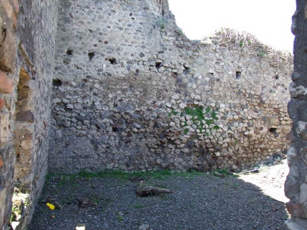 VIII.5.39 Pompeii. March 2009. Room 6, small garden area.  
South wall with window, and west wall. Looking west. According to Jashemski, this small garden area had a raised strip of soil at the base of the walls. In the middle was a pavement, serving as a passageway.
The small garden gave light to the triclinium through the window in the south wall. It also gave light to a room in a neighbour�s house on the west (VIII.5.2). See Jashemski, W. F., 1993. The Gardens of Pompeii, Volume II: Appendices. New York: Caratzas. (p.218)
