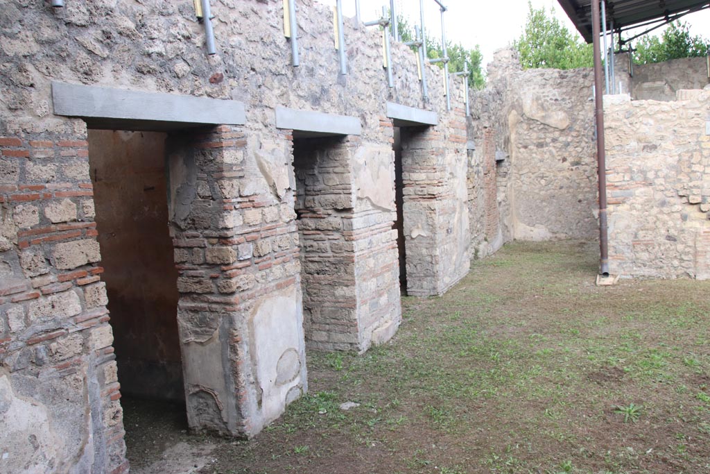 VIII.5.39 Pompeii. October 2023.
Looking north along doorways to rooms on west side of atrium from entrance doorway. Photo courtesy of Klaus Heese.