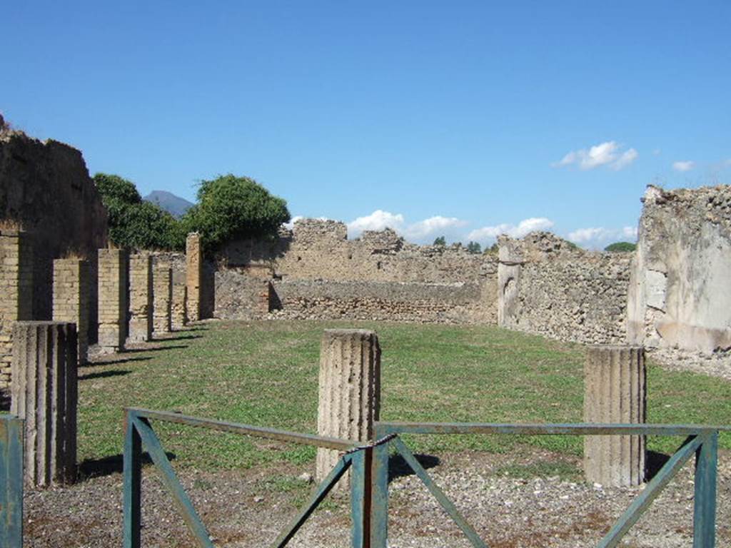VIII.6.2 Pompeii. September 2005. Looking north.
According to Jashemski, this large area had a portico on the west and the south. This portico was supported by pillars of brick and three old tufa columns. The columns, which were on the south, appeared to be the remains of an earlier building. The site was thought to have been still under construction in AD79, the roof of the portico not yet built. However, the intended use of the site was not known. See Jashemski, W. F., 1993. The Gardens of Pompeii, Volume II: Appendices. New York: Caratzas. (p.219)