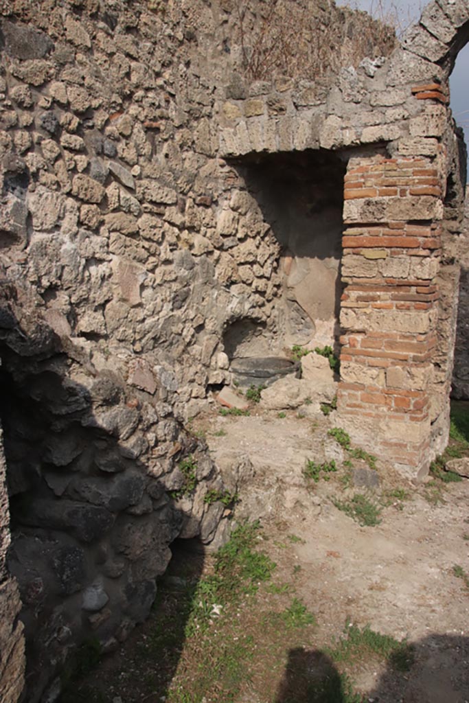 VIII.6.3 Pompeii. October 2023.
Room (d), looking north along west wall towards well (?), in room (e). Photo courtesy of Klaus Heese.