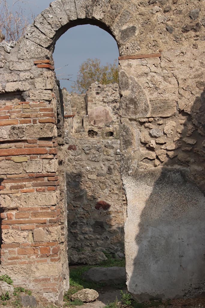 VIII.6.3 Pompeii. October 2023.
Room (d), north wall with doorway into room (e ). Photo courtesy of Klaus Heese.