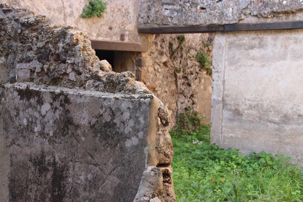 VIII.6.9 Pompeii. October 2022.
Looking south-west from entrance doorway towards doorway to basement room/water tank under VIII.6.10. Photo courtesy of Klaus Heese.