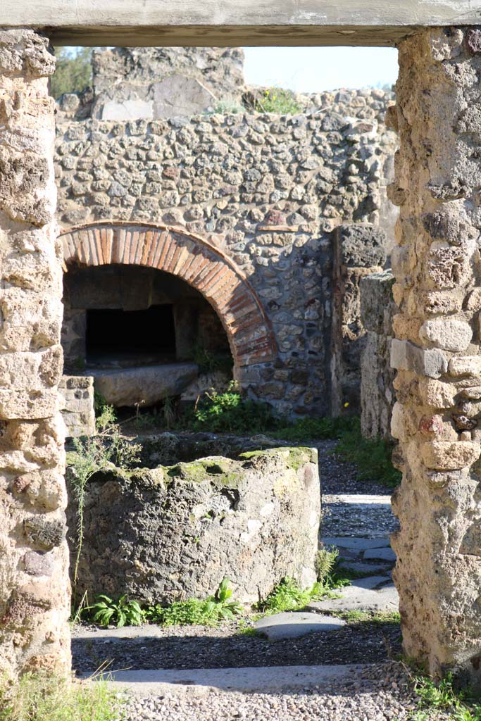 VIII.6.11, Pompeii. December 2018.
Looking east through doorway from room “f” or stable, towards bakery. Photo courtesy of Aude Durand.