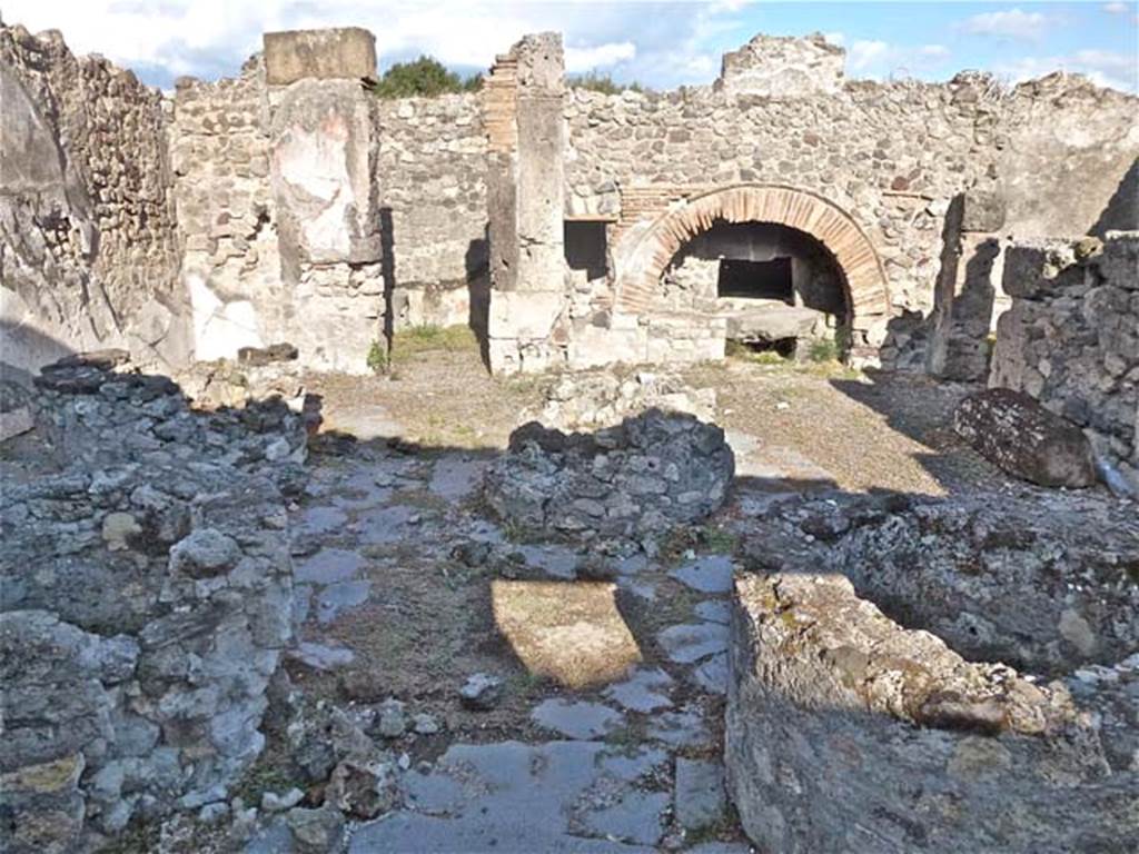 VIII.6.11 Pompeii. September 2011. Looking east across bakery.
The doorway to the room in north-east corner is in the centre left. The rooms on the south side of the bakery room are on the right.