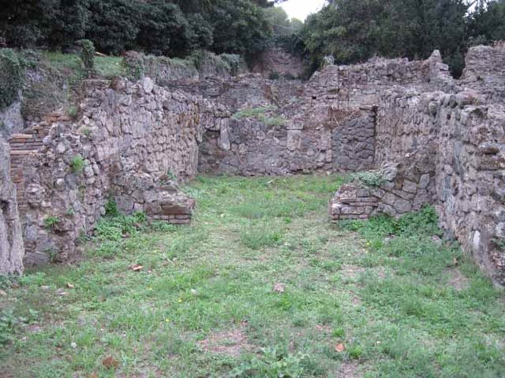 VIII.7.3 Pompeii. September 2010. Looking west across shop towards rear room, from entrance. Photo courtesy of Drew Baker.