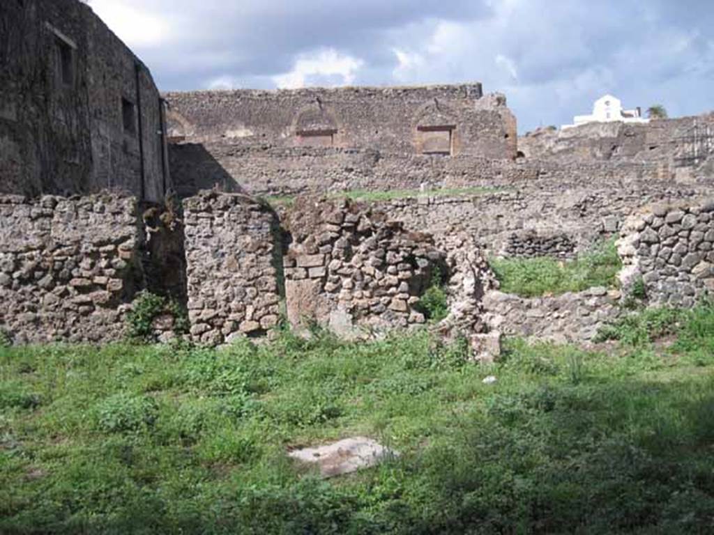 VIII.7.10 Pompeii. September 2010.
North wall of garden area, with entrance to northern garden of VIII.7.11. Photo courtesy of Drew Baker.
The doorway has been blocked, but there is no evidence of a lava step.
According to Jashemski, attached to the north wall were two masonry basins, and between them was the opening with a lava step in front of it.
This gave entry to the garden to the north.
See Jashemski, W. F., 1993. The Gardens of Pompeii, Volume II: Appendices. New York: Caratzas. (p.221).