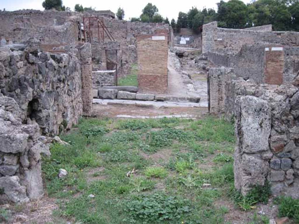 VIII.7.11 Pompeii. September 2010. Looking east from rear room across shop, to entrance on Via Stabiana. Photo courtesy of Drew Baker.