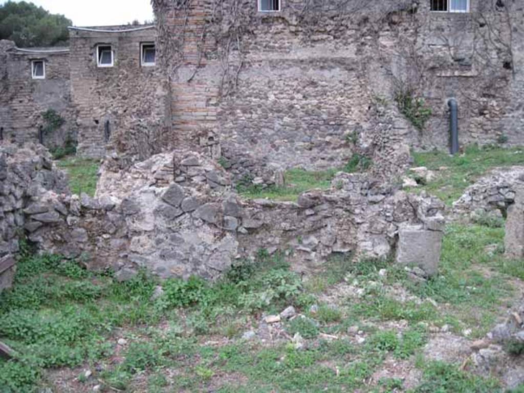 VIII.7.11 Pompeii. September 2010.
West wall of triclinium and doorway in north-west corner to corridor. Photo courtesy of Drew Baker.