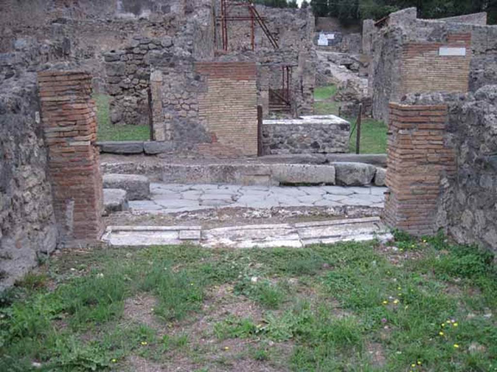 VIII.7.12 Pompeii. September 2010. Looking east across shop towards entrance on Via Stabiana. Photo courtesy of Drew Baker.