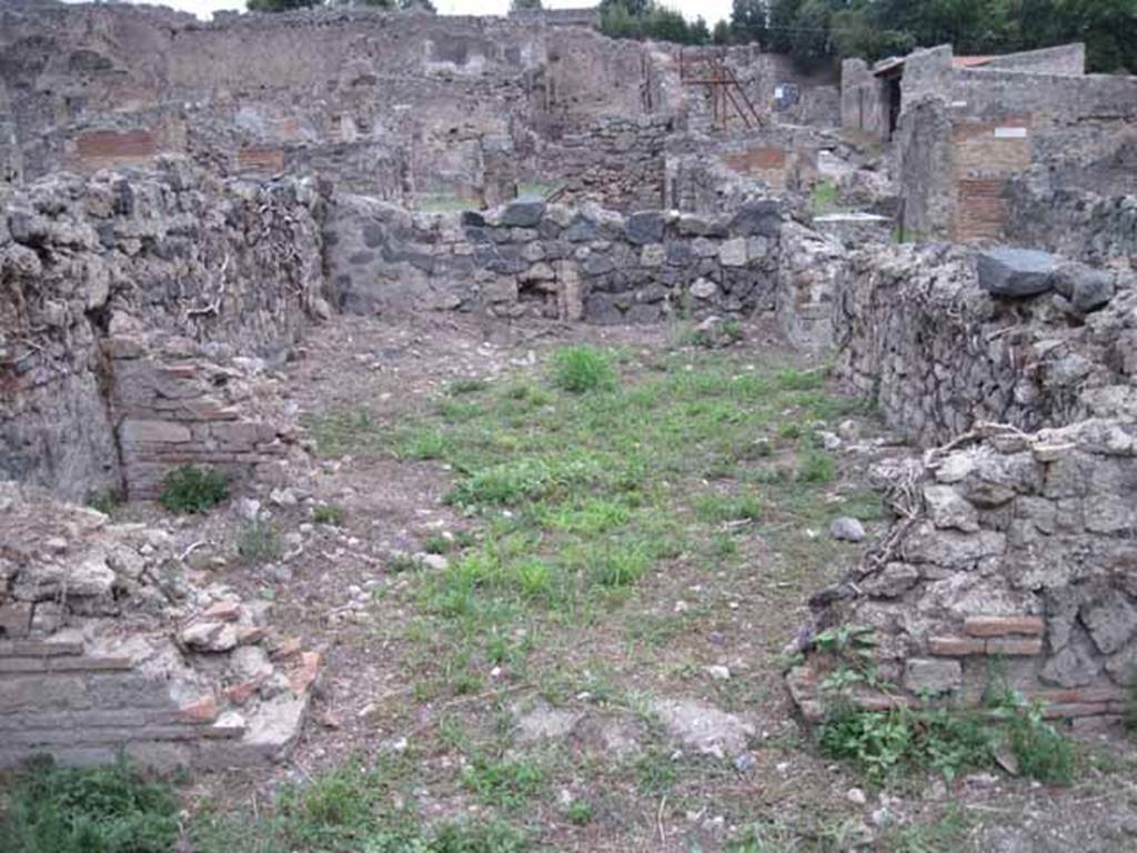 VIII.7.12 Pompeii. September 2010.
Looking east into spacious triclinium fenestratum towards remains of wall with window, from the garden area. Photo courtesy of Drew Baker.
According to Mau –
“on the right (of the corridor) was a spacious triclinium, with two doors, one onto the corridor, one onto the locality at the end of it, which seems to have been a garden and at the end of which stands the wide entrance of a room not yet excavated, in the middle of which stands a brick column.”
See Bullettino dell’Instituto di Corrispondenza Archeologica (DAIR), 1875 (p.169).