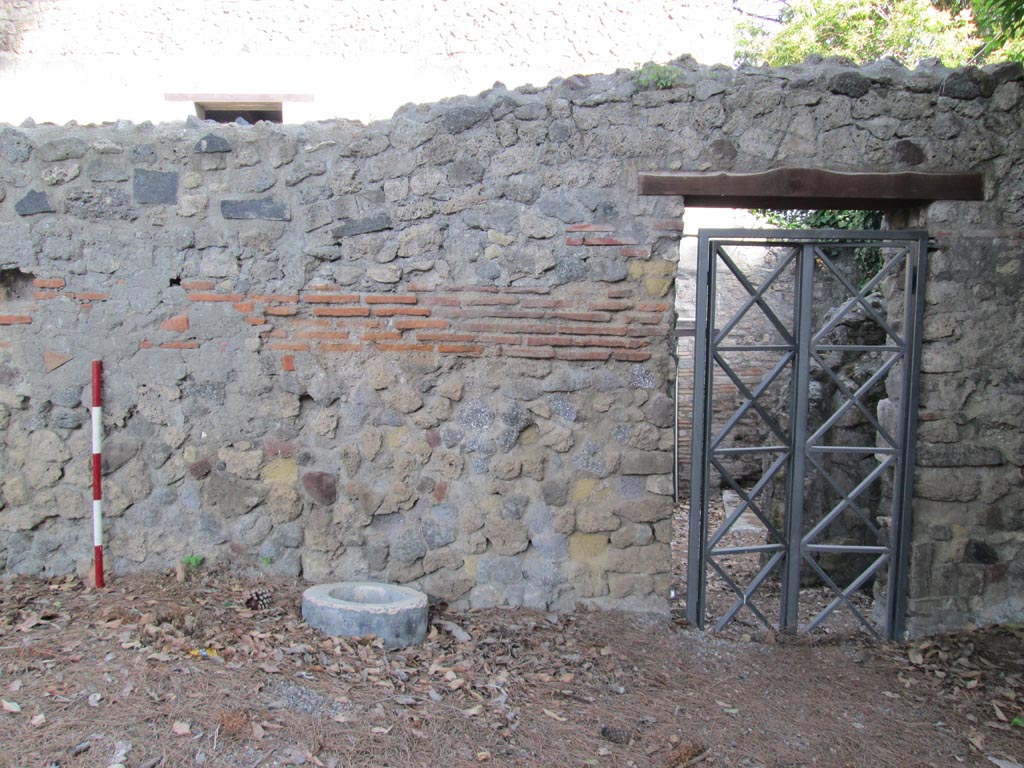 VIII.7.16 Pompeii. July 2012.
Looking north towards exterior of entrance doorway in south-east corner. Photo courtesy of Eric Poehler.