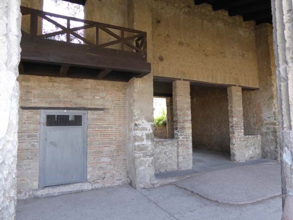 VIII.7.16 Pompeii. October 2014. South side, with reconstructed balcony on upper floor, and entrance to exedra, on right. This exedra is now used an entrance/exit. Photo courtesy of Michael Binns.