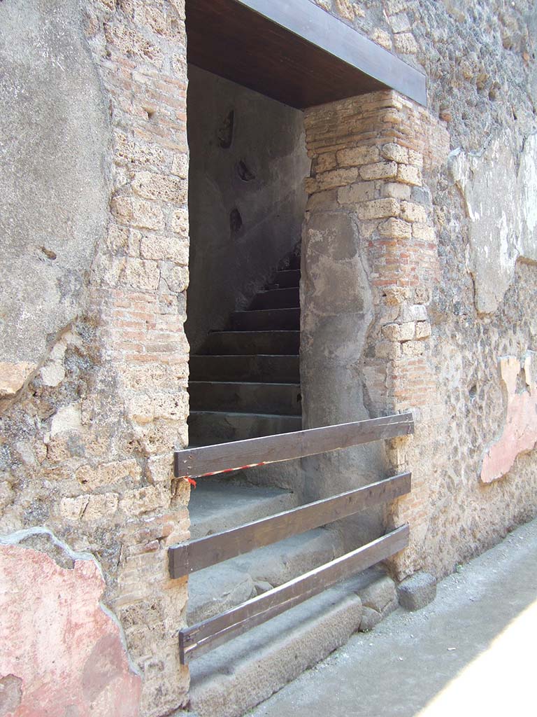 VIII.7.20 Pompeii. May 2006. South wall.
First, east rear entrance to the Little Theatre or Odeon with steps to upper seating.