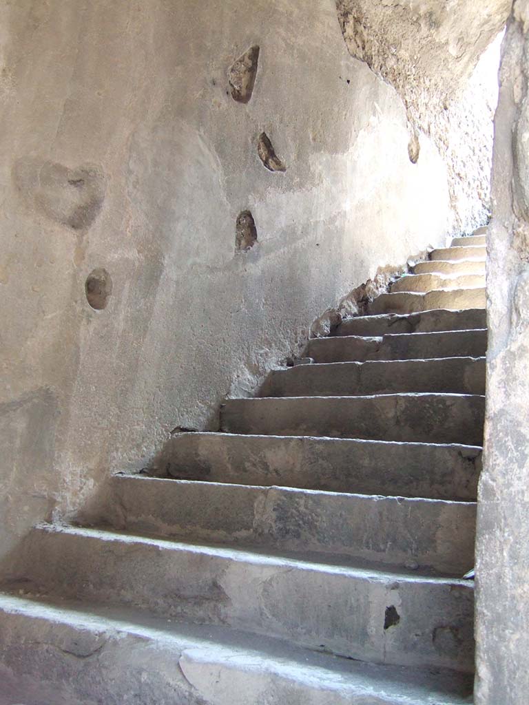 VIII.7.20 Pompeii. May 2006.
First, east rear entrance to the Little Theatre or Odeon with steps to upper seating.