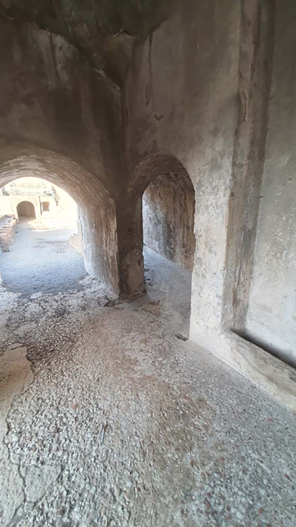 VIII.7.20 Pompeii. August 2021. Looking west to entrances to the Large Theatre.
On the left to the area in front of the stage known as the orchestra.
On the right the arched entrance to the ramp leading to media cavea.
Foto Annette Haug, ERC Grant 681269 DÉCOR.