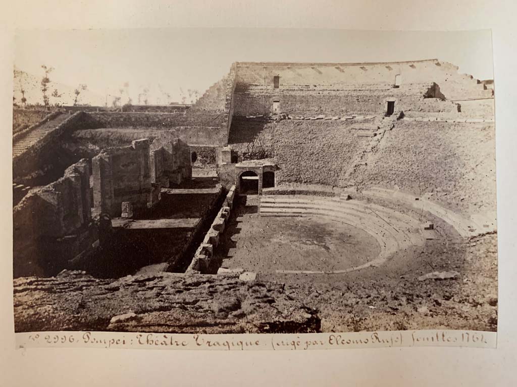 VIII.7.20 Pompeii. Album by M. Amodio, c.1880, entitled “Pompei, destroyed on 23 November 79, discovered in 1748”.
Looking west across Theatre, with steps to Triangular Forum, on left. Photo courtesy of Rick Bauer.