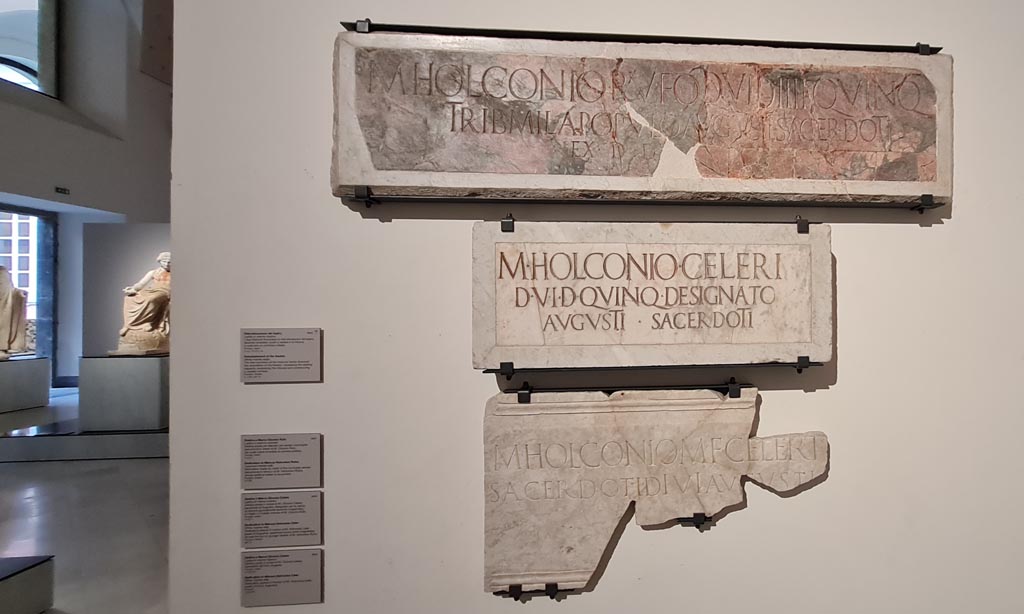 VIII.7.20 Pompeii. April 2023. Detail of the lower three Dedications, as seen on the descriptive notice-card, above.
Photo courtesy of Giuseppe Ciaramella.