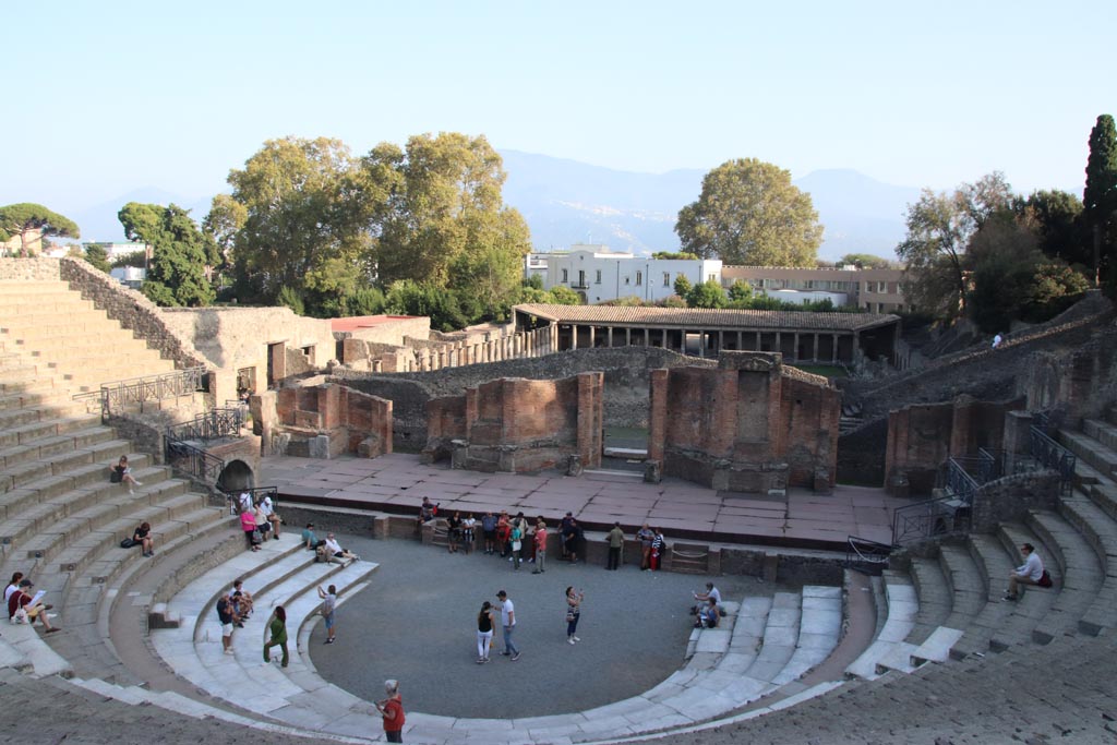 VIII.7.20 Pompeii. October 2023. Looking south-east across stage towards Gladiators Barracks. Photo courtesy of Klaus Heese.