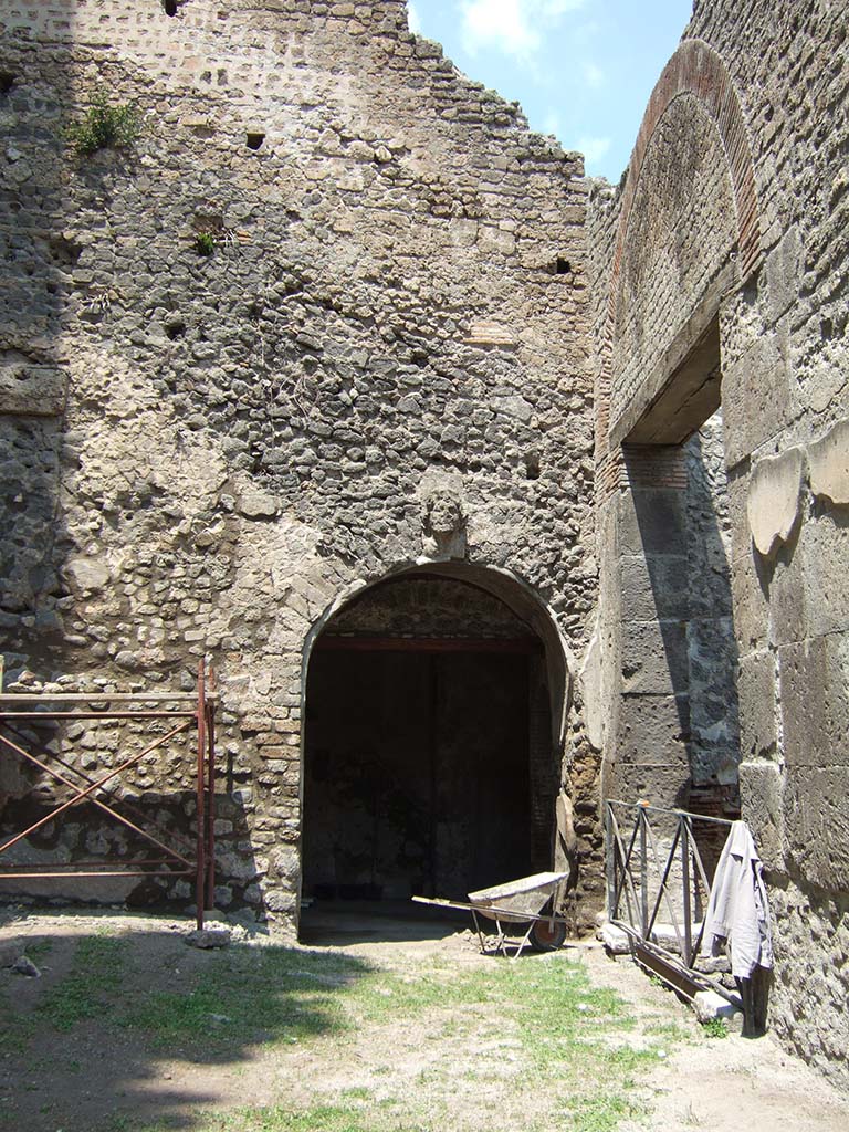 VIII.7.20 Pompeii. May 2006.
West side. Entrance to room with entrance/exit from Theatre, under the seating.