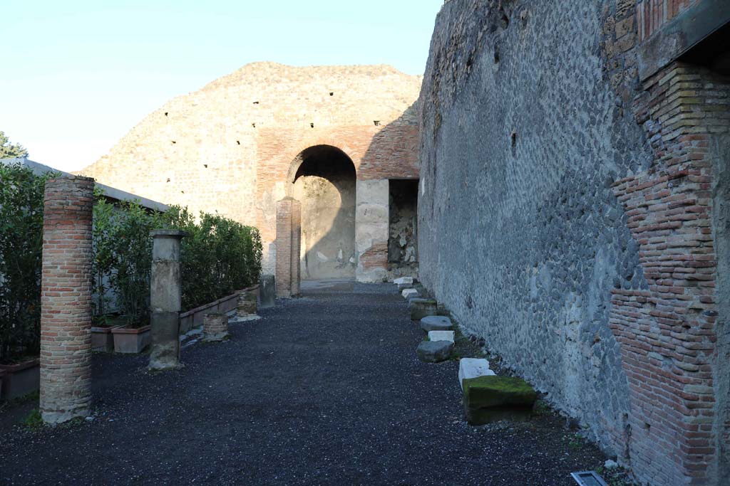 VIII.7.20 Pompeii. December 2018.
East side. Looking north in area behind the stage, with entrance to Little Theatre, on right. Photo courtesy of Aude Durand.