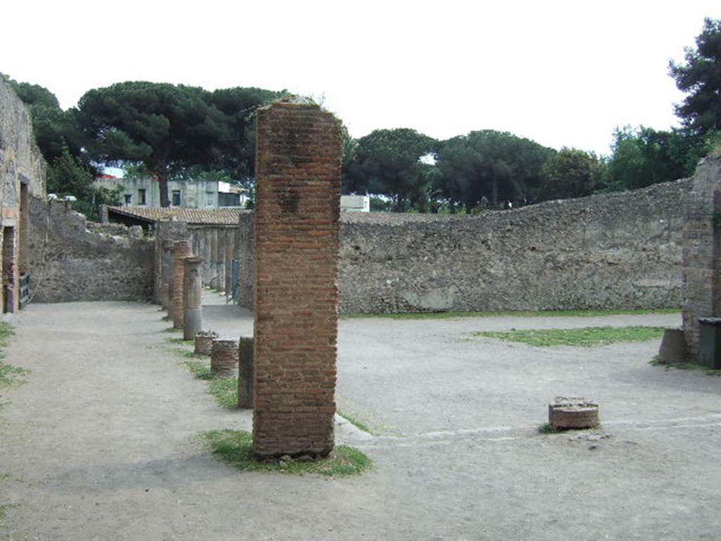 VIII.7.20 Pompeii. May 2006. East side. Looking south past the area behind the stage, towards the Gladiators Barracks.
