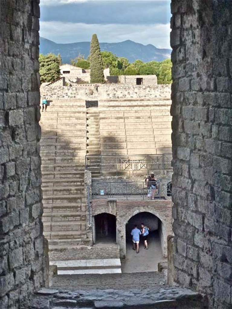 VIII.7.20 Pompeii. September 2011. Large Theatre, looking east. Above the arched entrance would have been the Tribunal. Photo courtesy of Michael Binns.