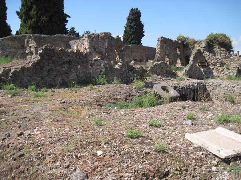 VIII.7.24 Pompeii. September 2010. West wall of garden area looking north-west towards Temple of Isis. Photo courtesy of Drew Baker.