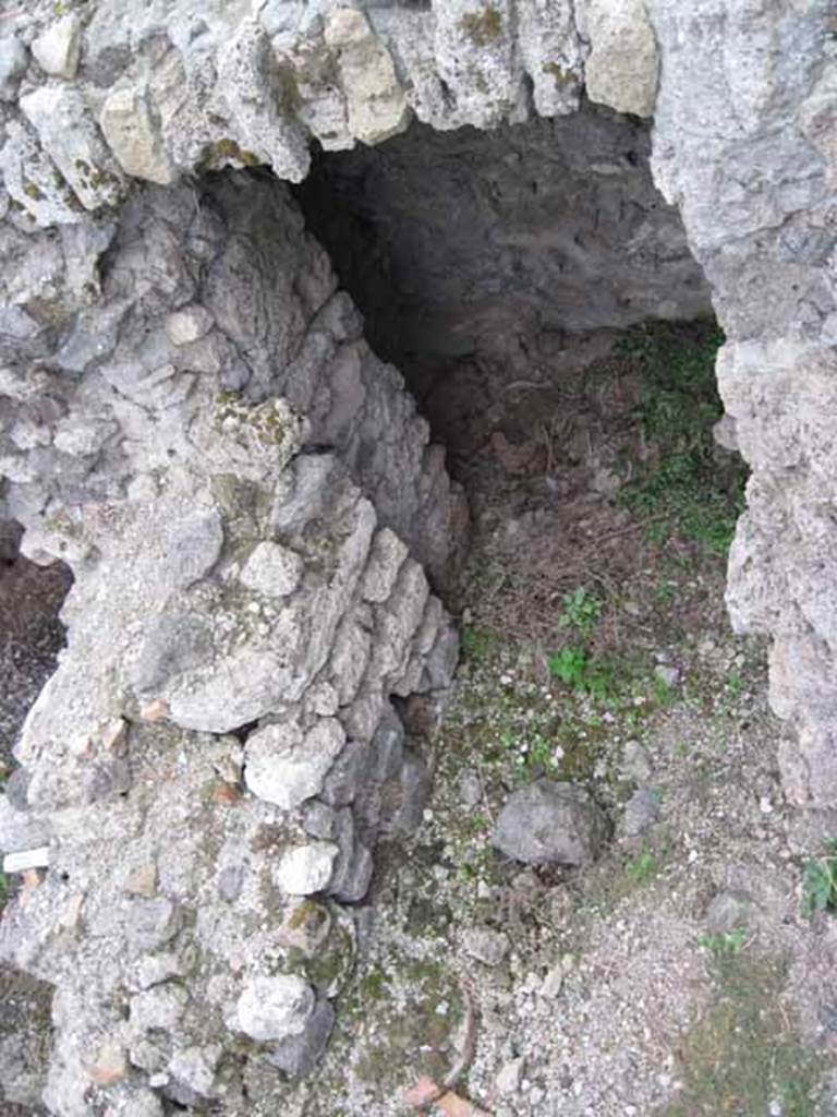 VIII.7.22/23/24 Pompeii. October 2010. From upper level of VIII.7.24, looking down to lower level at the rear of VIII.7.23/22 showing access doorway to the underground parts. Looking east. Photo and information courtesy of Drew Baker/Gareth Beale/Hembo Pagi.