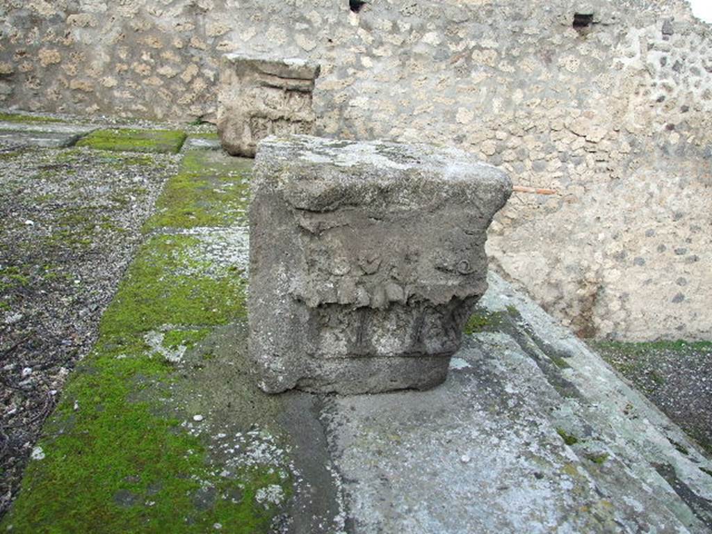 VIII.7.25 Pompeii. December 2006. Capitals on podium.