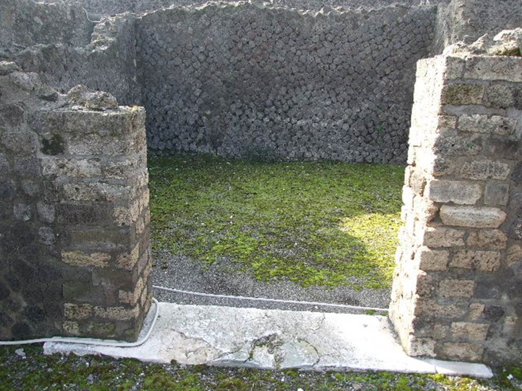 VIII.7.25 Pompeii. December 2006. Doorway to Cella on podium.