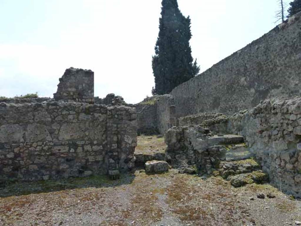 VIII.7.26 Pompeii. May 2010. Looking south across main entrance room, towards the corridor leading to the house at rear, and the steps to the upper floor.