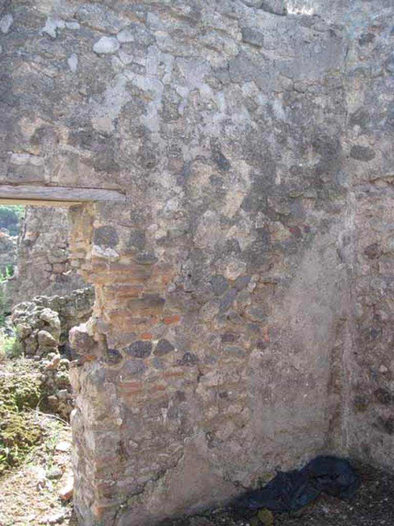 VIII.7.26 Pompeii. September 2010. South wall and south-west corner, looking south through doorway towards north portico. Photo courtesy of Drew Baker.