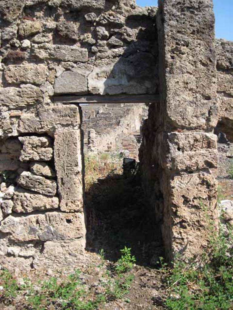 VIII.7.26 Pompeii. September 2010. Small doorway in east wall, leading to small storeroom or cupboard. Photo courtesy of Drew Baker.
