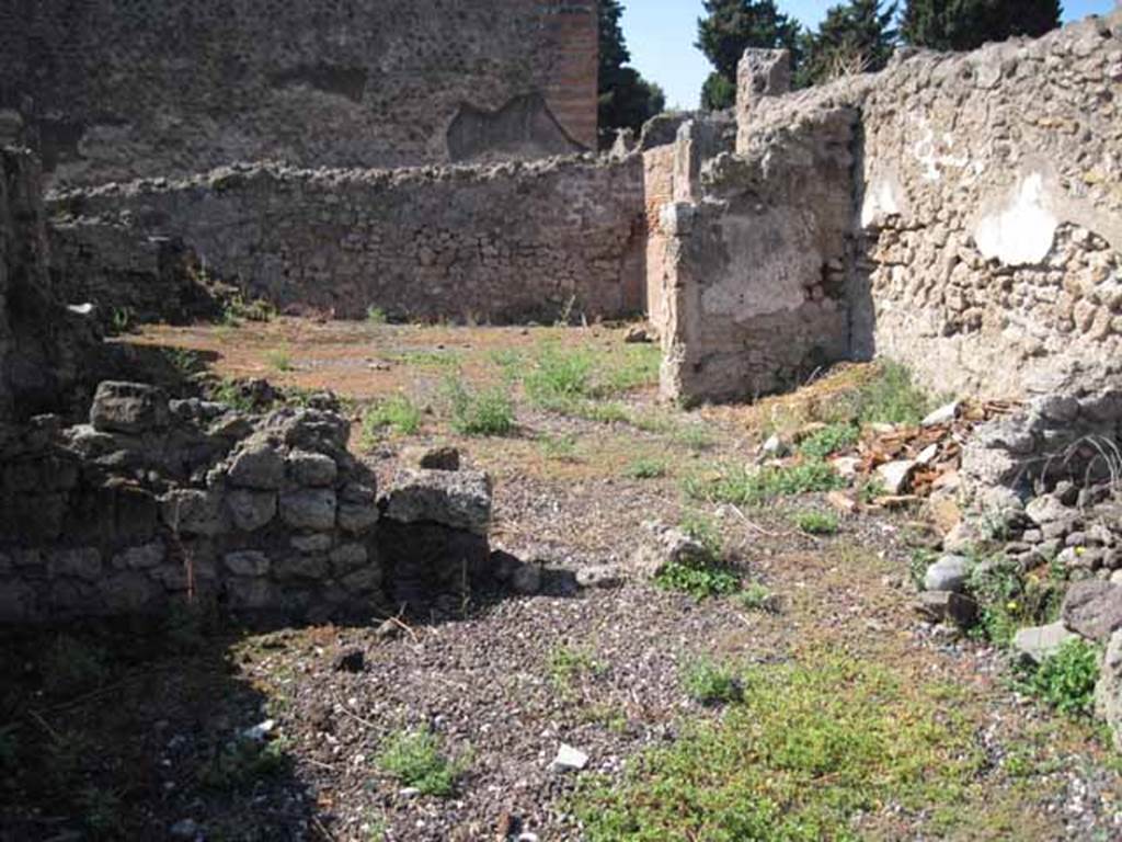 VIII.7.26 Pompeii. September 2010. Remains of west wall, looking west into third room, followed by room with entrance doorway. Photo courtesy of Drew Baker.