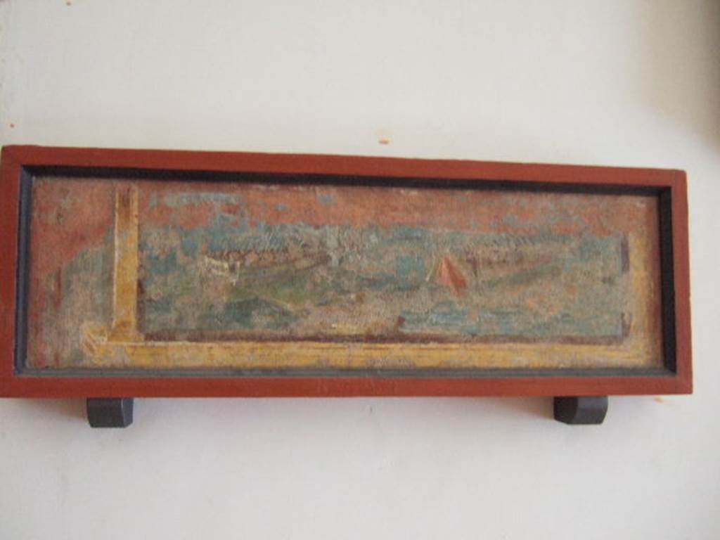 VIII.7.28 Pompeii. From east part of north portico. Naval scene.
It was part of an architectural panel, which was left in situ, probably due to its poor condition.
Now in Naples Archaeological Museum. Inventory number 8590.