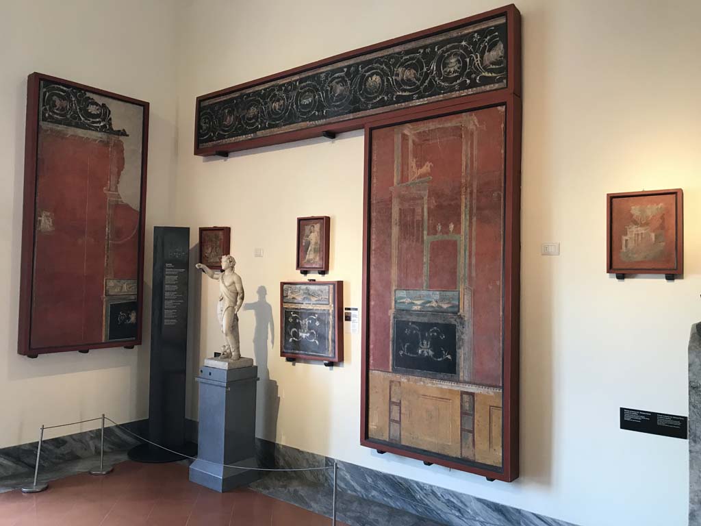VIII.7.28 Pompeii. April 2019. West part of north portico.
Top is fresco with a continuous sequence of scrolls and acanthus scrolls.
Now in Naples Archaeological Museum. Inventory number 8553.
Large panel to the right is a naval scene in architectural setting.
Now in Naples Archaeological Museum. Inventory number 8529.
Photo courtesy of Rick Bauer.
