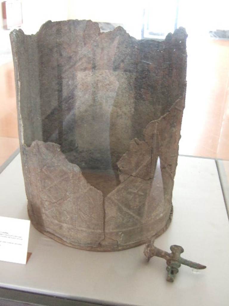 VIII.7.28 Pompeii. Water container decorated with themes of Isis.
Found in the north-east corner of the portico. Now in Naples Archaeological Museum.