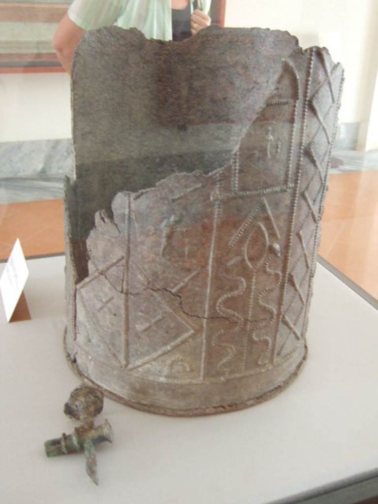 VIII.7.28 Pompeii. Water container decorated with themes of Isis.
Found in the north-east corner of the portico. Now in Naples Archaeological Museum.