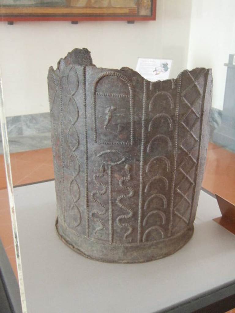 VIII.7.28 Pompeii. Water container decorated with themes of Isis.
Found in the north-east corner of the portico. Now in Naples Archaeological Museum.