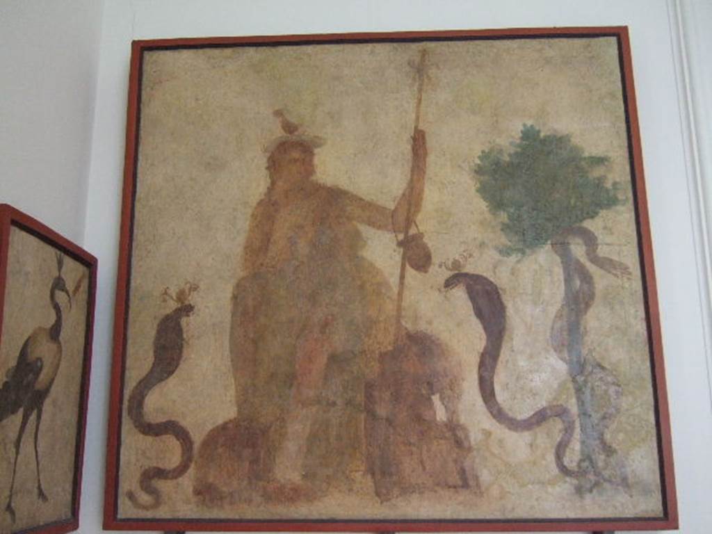 VIII.7.28 Pompeii. West wall of sacrarium. Painting of god Osiris on a throne and with cobras.
Now in Naples Archaeological Museum. Inventory number 8927.