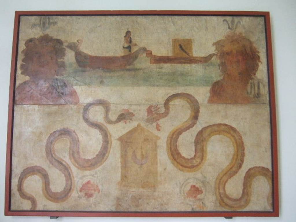VIII.7.28 Pompeii. Found on north wall of the sacrarium. Ship of Isis, transporting Osiris, and busts of river (Nile?) gods. Two serpents are moving towards a basket which has a crescent moon symbol on it. Now in Naples Archaeological Museum. Inventory number 8929.