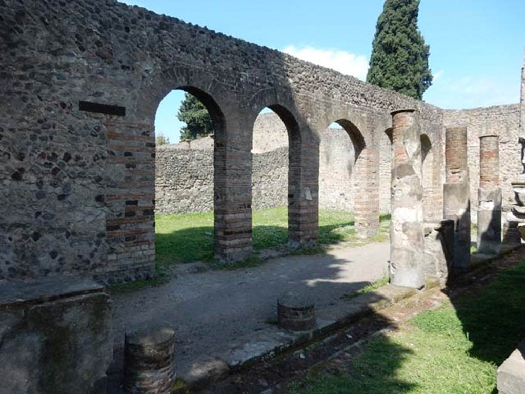VIII.7.28, Pompeii. May 2015. Looking towards west wall of portico and the arches of the Ekklesiasterion, from south-west corner.
Photo courtesy of Buzz Ferebee.
