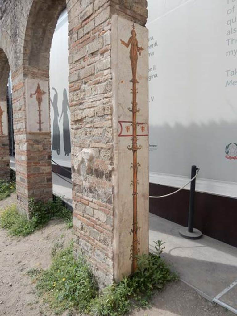 VIII.7.28 Pompeii. May 2017. Reproduction candelabra frescoes on arches in the Ekklesiasterion.
The longer fresco is on the south wall of the first arch from the north and shows a priestess, on the top of a candelabrum, carrying a small crocodile in her right hand, and a tray and vase in her left.
Now in Naples Archaeological Museum. Inventory number 9768.
The shorter fresco is on the south wall of the second arch from the north and shows a priestess, on the top of a candelabrum, holding a cobra and jar.
Now in Naples Archaeological Museum. Inventory number 8928.
Photo courtesy of Buzz Ferebee.