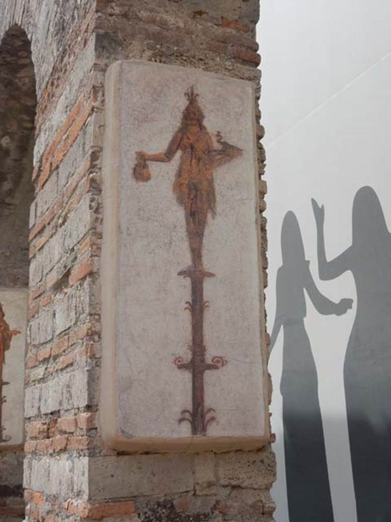 VIII.7.28 Pompeii. May 2017. Reproduction fresco on south wall of second arch from north in the Ekklesiasterion.
Priestess on a candelabrum with jar and peacock.
Now in Naples Archaeological Museum. Inventory number 8915.
Photo courtesy of Buzz Ferebee.
