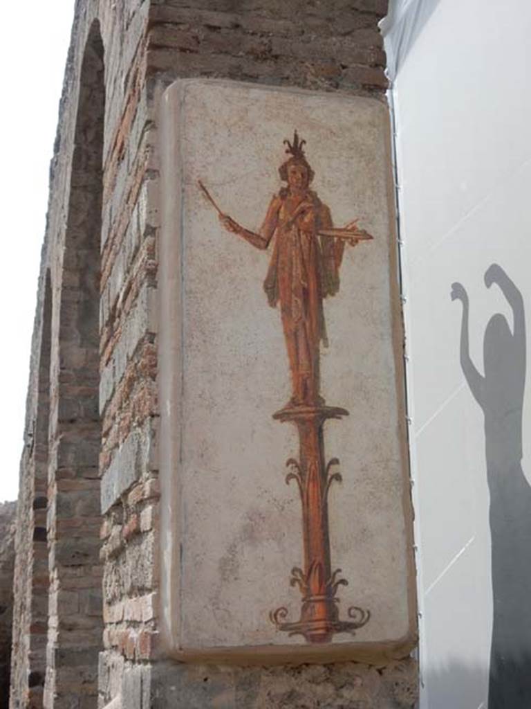 VIII.7.28 Pompeii. May 2017. Reproduction fresco on south side of central arch in the Ekklesiasterion.
Priestess on a candelabrum carrying offerings on a tray.
Now in Naples Archaeological Museum. Inventory number 8917.
Photo courtesy of Buzz Ferebee.