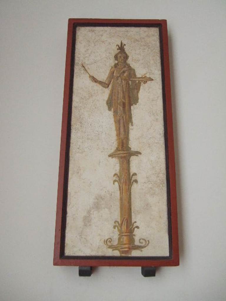 VIII.7.28 Pompeii. Priestess on a candelabrum carrying offerings on a tray.
Found in passageway of arch. Now in Naples Archaeological Museum.