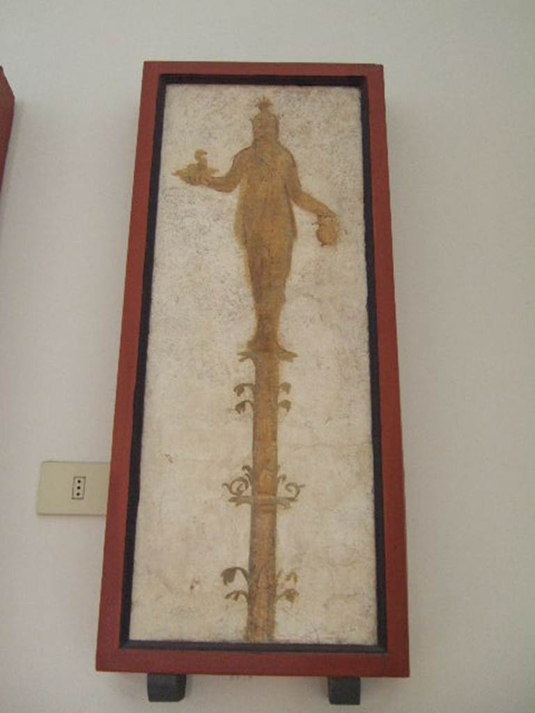 VIII.7.28 Pompeii. Priestess on a candelabrum with a cobra and jar.
Found in passageway of arch. Now in Naples Archaeological Museum.