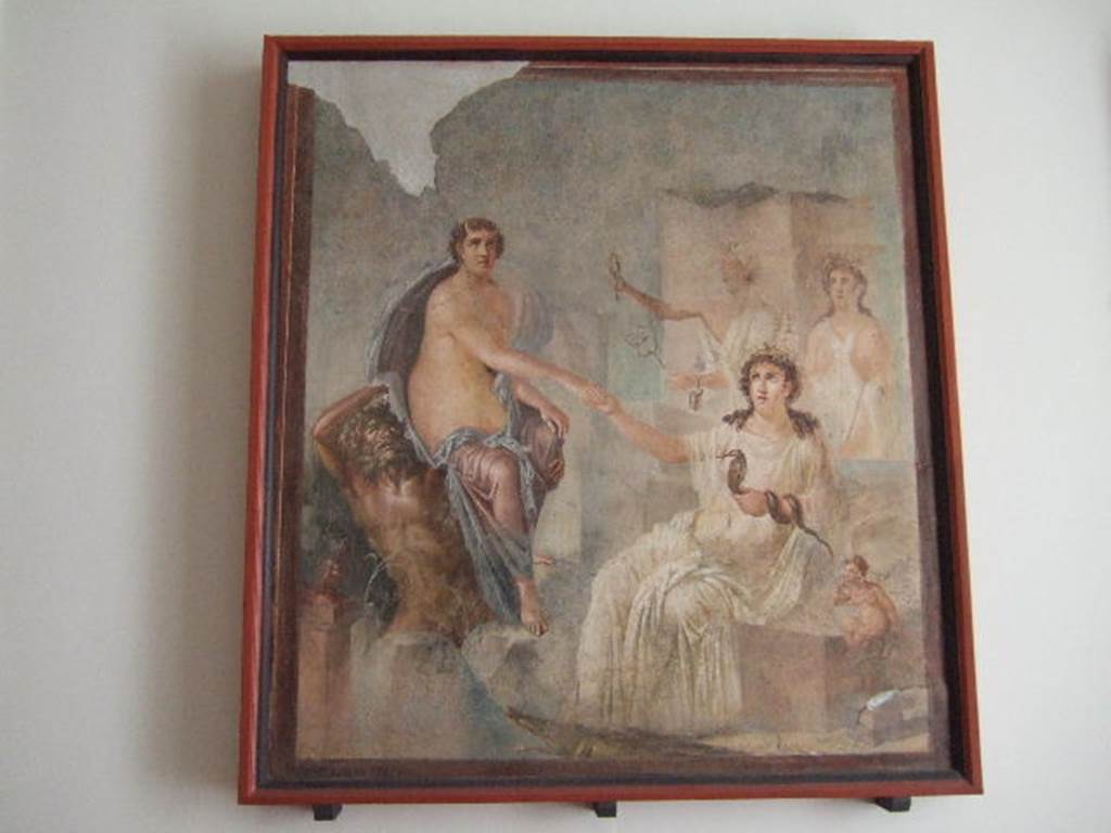 VIII.7.28 Pompeii. Arrival of Io, still horned, but now in the care of a sea deity, at Canopus.
Isis offers her hand as her priestesses shake their sistra.
Found in the centre of the south wall of the Ekklesiasterion in November 1765.
Now in Naples Archaeological Museum. Inventory number 9558.