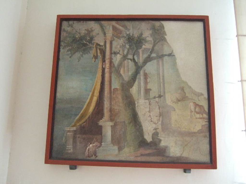 VIII.7.28 Pompeii. Found in the Ekklesiasterion, on the west wall at the north end.
The painting shows references to the Egyptian cults, with the sacred door, the temple, and the amphora with Garland, which is a reminder of the containers of holy water used during the rites of the cult of Isis. Ten similar amphorae were found at Pompeii with the inscription Serapis dora.
Now in Naples Archaeological Museum. Inventory number 8558.