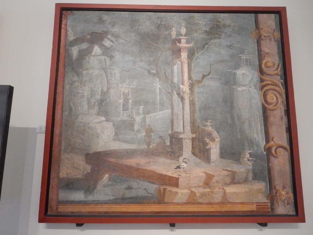 VIII.7.28 Pompeii. June 2019.
Painting of rocky landscape with little temples, statue, fisherman and ibis, found on the left area of the north wall of Ekklesiasterion.
Photo courtesy of Buzz Ferebee.